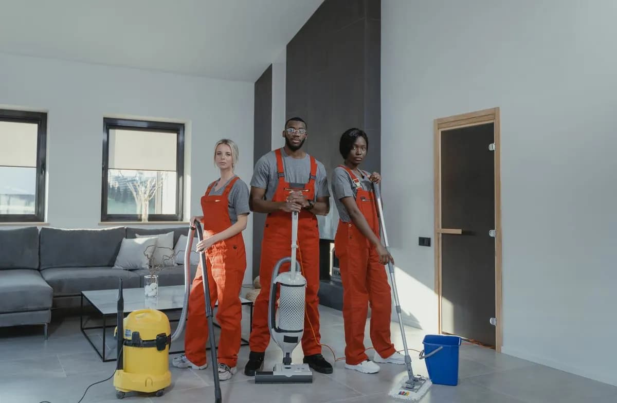 Professional cleaner caring for desks in a contemporary office.